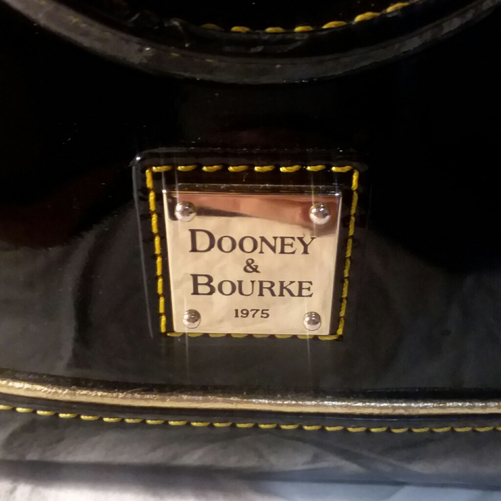 Dooney & Bourke 1975 Black patent leather day bag.